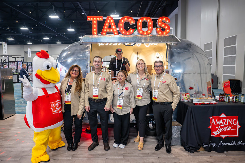 Amazing Taste vendors posing in front of their exhibit