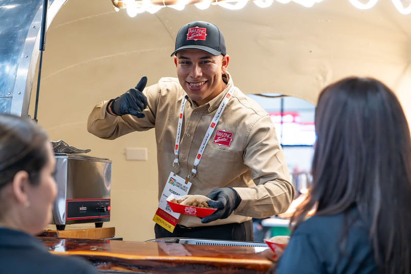 Sponsor serving food at Annual Meat Conference