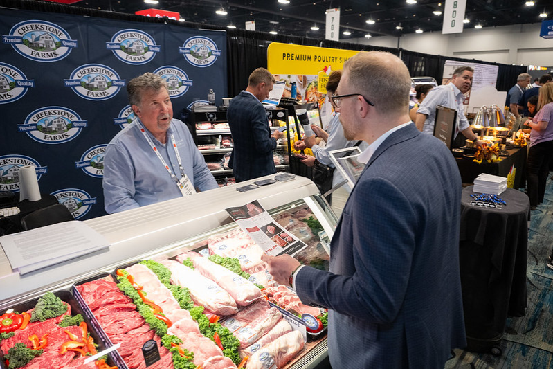 Man asking questions at booth